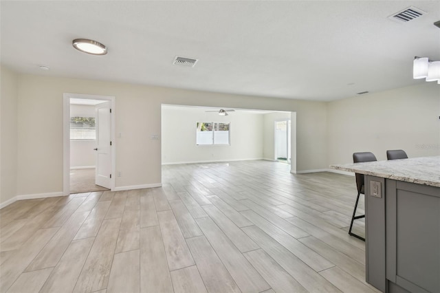 94 Nicholas Dr, Dunedin, FL 34698 - living area with light wood finished floors and baseboards