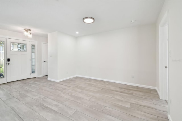 94 Nicholas Dr, Dunedin, FL 34698 - entrance foyer with light wood-style floors and baseboards