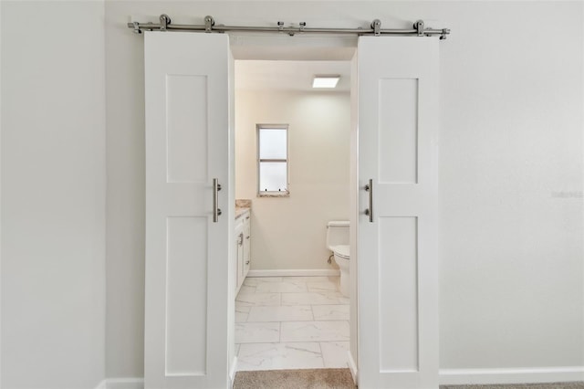 94 Nicholas Dr, Dunedin, FL 34698 - bathroom with marble finish flooring, vanity, toilet, and baseboards