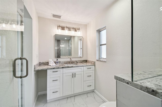 94 Nicholas Dr, Dunedin, FL 34698 - bathroom with baseboards, marble look tile flooring, vanity, a shower stall, and toilet
