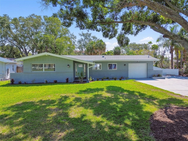 94 Nicholas Dr, Dunedin, FL 34698 - view of front of house featuring brick siding, a garage, and driveway