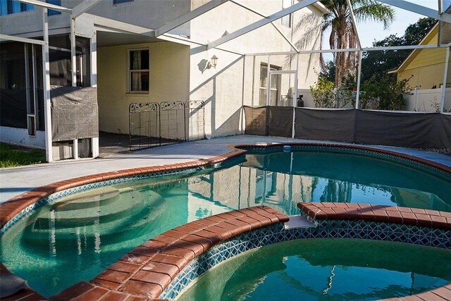 1204 Rinkfield Pl, Brandon, FL 33511 - view of pool featuring a patio, a lanai, and a pool with connected hot tub