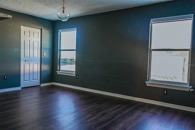 1204 Rinkfield Pl, Brandon, FL 33511 - unfurnished room with wood finished floors, a textured ceiling, and baseboards
