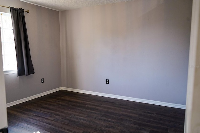 1204 Rinkfield Pl, Brandon, FL 33511 - unfurnished room with dark wood-style floors, a textured ceiling, and baseboards