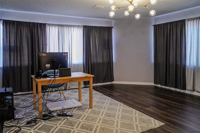 1204 Rinkfield Pl, Brandon, FL 33511 - home office with wood finished floors, a chandelier, baseboards, and a textured ceiling