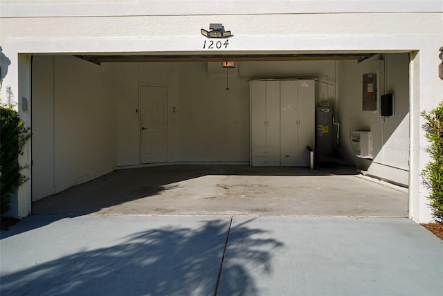 1204 Rinkfield Pl, Brandon, FL 33511 - garage featuring electric panel, a garage door opener, concrete driveway, and electric water heater