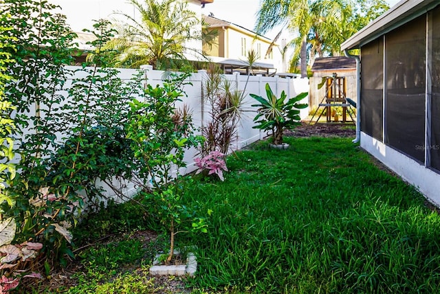 1204 Rinkfield Pl, Brandon, FL 33511 - view of yard with a playground and a sunroom