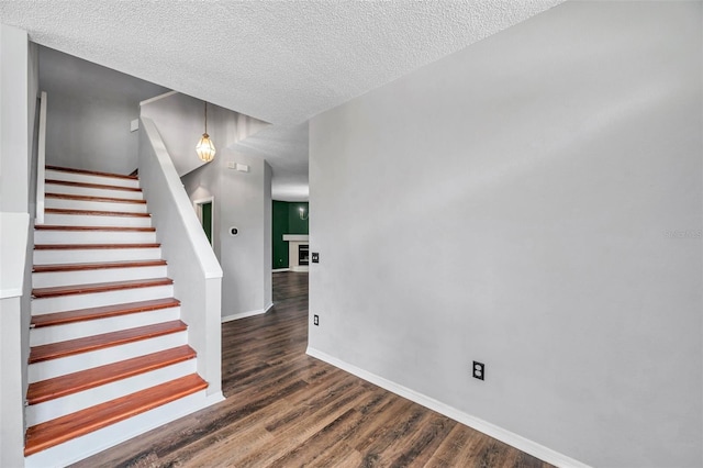1204 Rinkfield Pl, Brandon, FL 33511 - staircase featuring a textured ceiling and wood finished floors