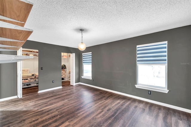 1204 Rinkfield Pl, Brandon, FL 33511 - spare room with wood finished floors and a textured ceiling
