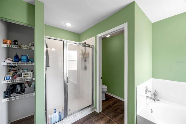 1204 Rinkfield Pl, Brandon, FL 33511 - full bathroom featuring a stall shower, a garden tub, and wood finished floors