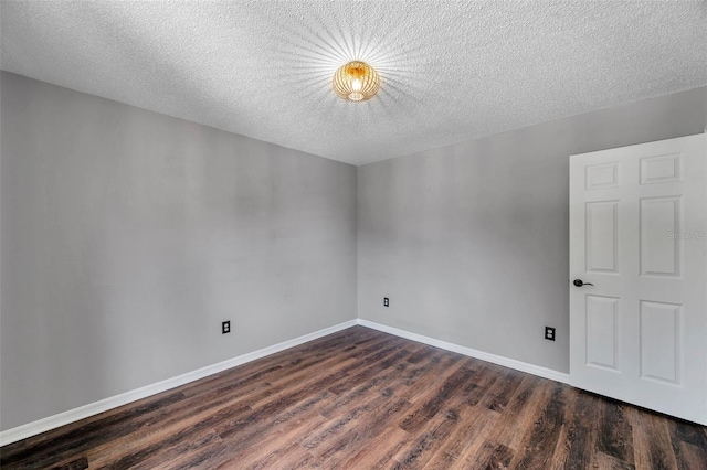 1204 Rinkfield Pl, Brandon, FL 33511 - empty room featuring dark wood finished floors and a textured ceiling