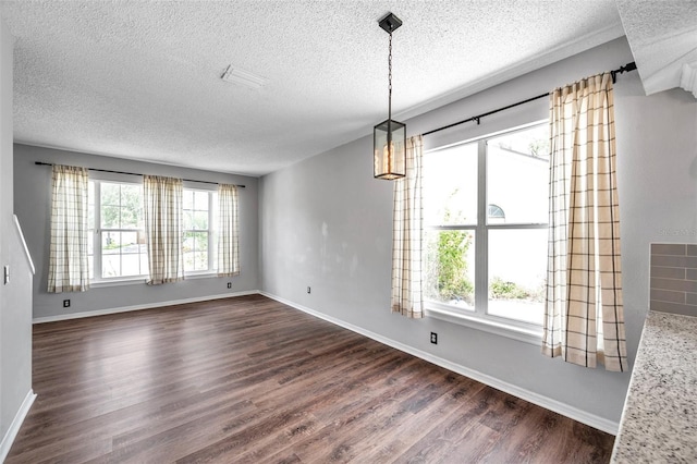 1204 Rinkfield Pl, Brandon, FL 33511 - unfurnished dining area with a textured ceiling, dark wood-type flooring, and a chandelier