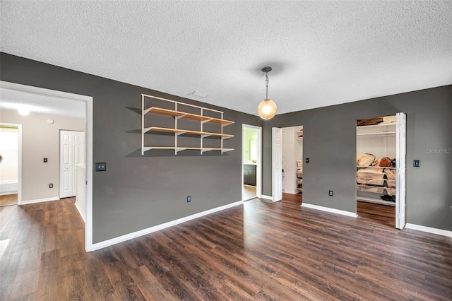 1204 Rinkfield Pl, Brandon, FL 33511 - empty room with a textured ceiling and dark wood-style flooring