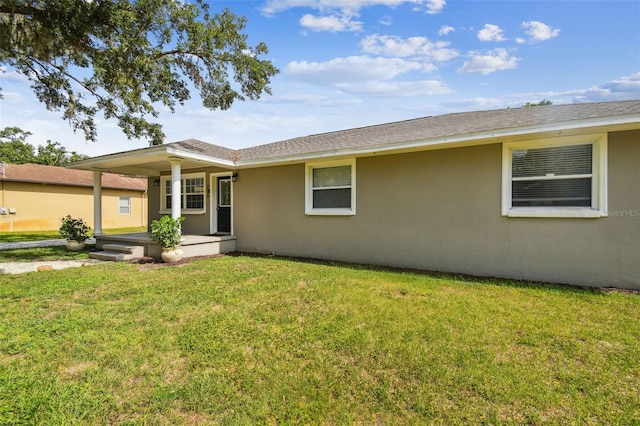 205 W 122nd Ave, Tampa, FL 33612 - view of front of property with stucco siding, a front yard, and a porch