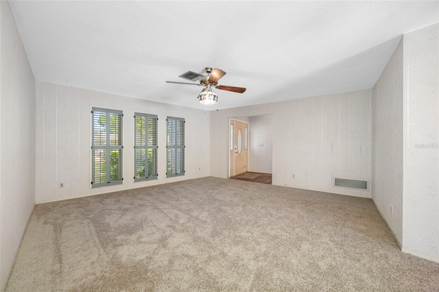 1211 Stony Brook Ln, Dunedin, FL 34698 - spare room featuring ceiling fan and carpet floors