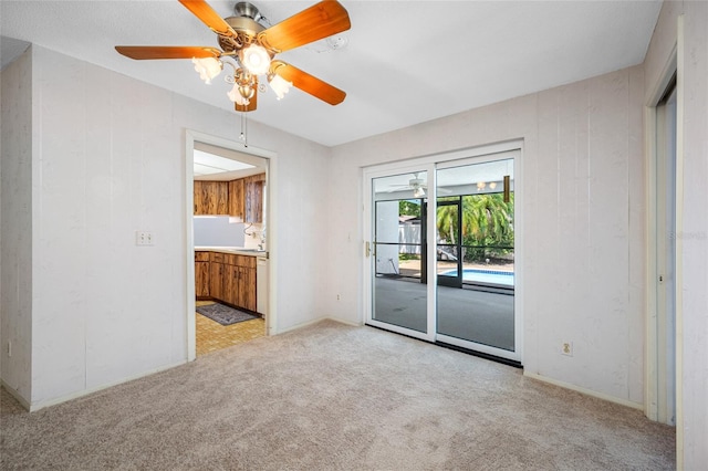 1211 Stony Brook Ln, Dunedin, FL 34698 - empty room with light colored carpet, a ceiling fan, and a sink
