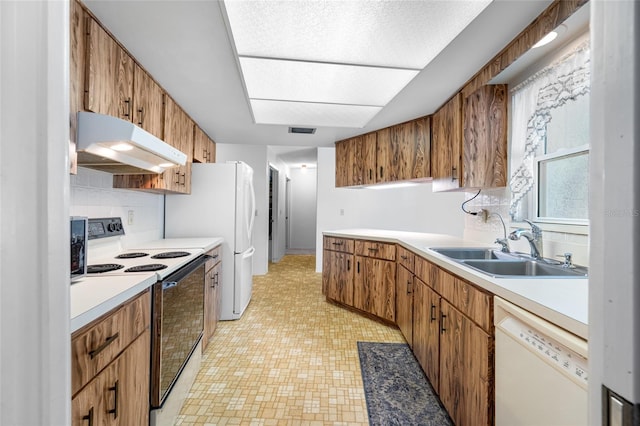 1211 Stony Brook Ln, Dunedin, FL 34698 - kitchen with white appliances, under cabinet range hood, a sink, tasteful backsplash, and light countertops