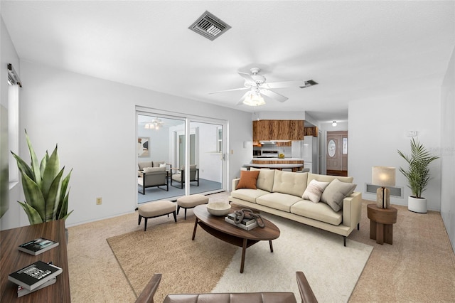 1211 Stony Brook Ln, Dunedin, FL 34698 - living room featuring light colored carpet and ceiling fan
