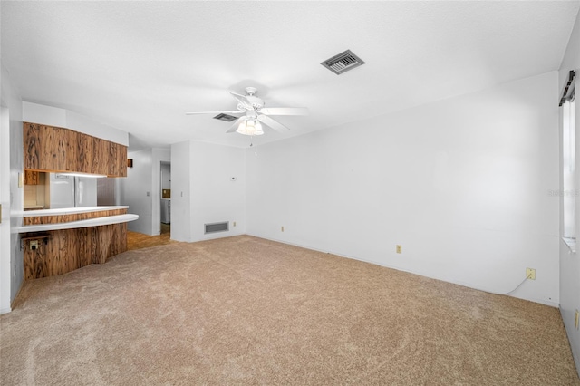 1211 Stony Brook Ln, Dunedin, FL 34698 - unfurnished living room featuring ceiling fan and light carpet
