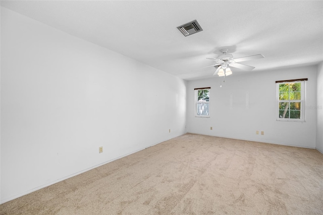 1211 Stony Brook Ln, Dunedin, FL 34698 - empty room with a ceiling fan and carpet flooring