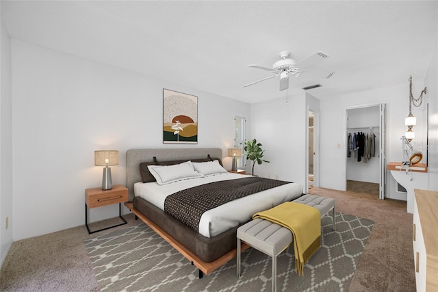 1211 Stony Brook Ln, Dunedin, FL 34698 - bedroom featuring carpet flooring, a closet, a walk in closet, and ceiling fan