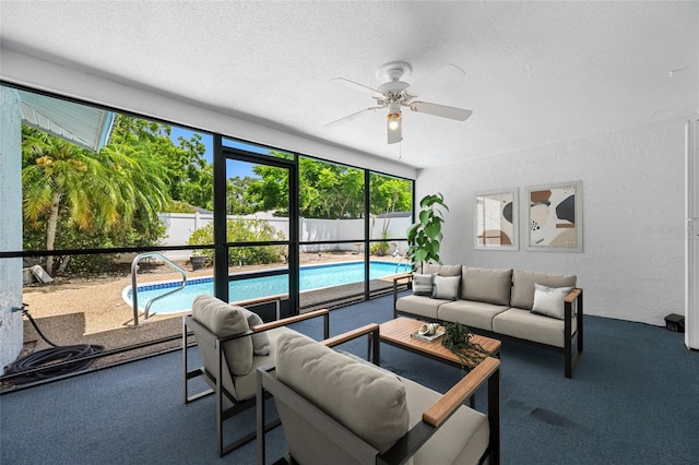 1211 Stony Brook Ln, Dunedin, FL 34698 - living area featuring a ceiling fan, a textured ceiling, a textured wall, and carpet
