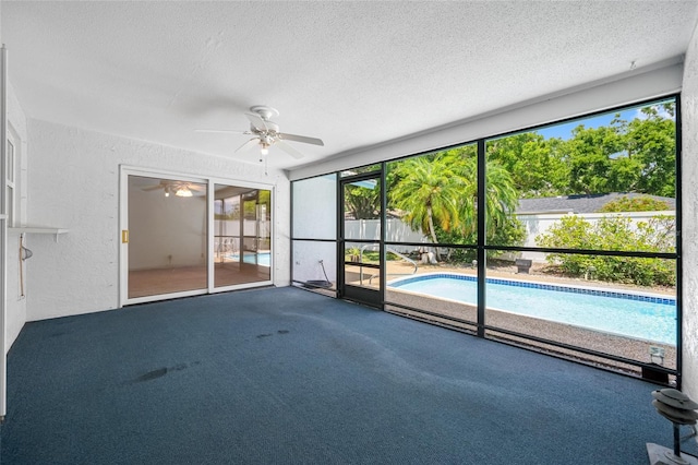 1211 Stony Brook Ln, Dunedin, FL 34698 - spare room featuring a ceiling fan, a textured ceiling, carpet flooring, and a textured wall