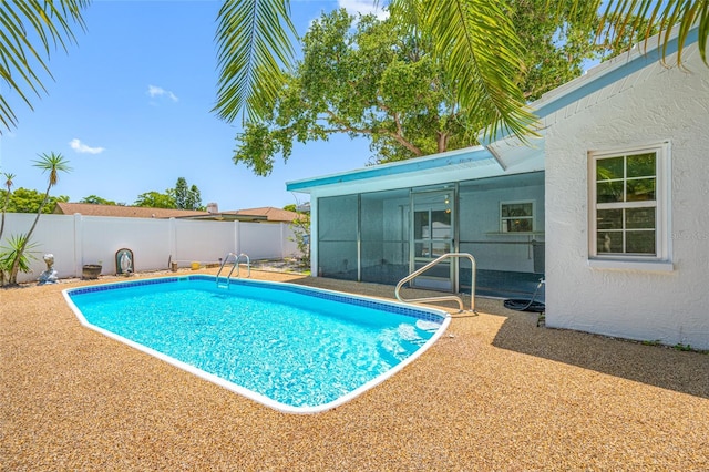 1211 Stony Brook Ln, Dunedin, FL 34698 - view of pool with a fenced backyard, a sunroom, and a patio area