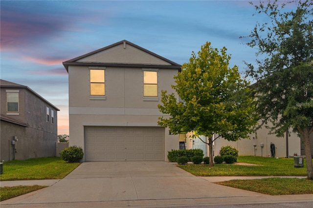 6180 Spring Crayfish Ave, New Port Richey, FL 34653 - view of front of property featuring driveway, an attached garage, stucco siding, and a lawn