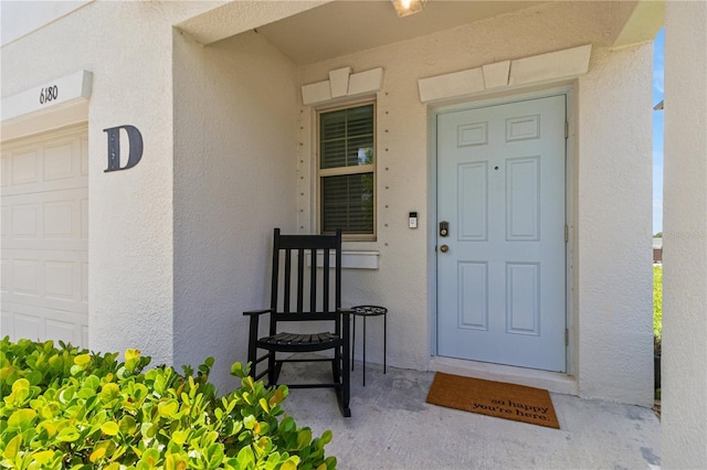 6180 Spring Crayfish Ave, New Port Richey, FL 34653 - view of exterior entry with stucco siding