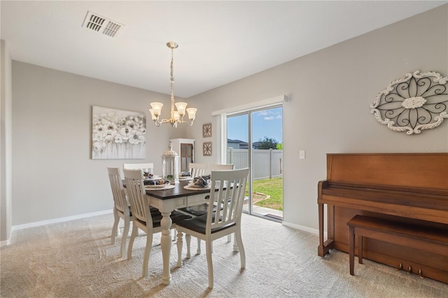 6180 Spring Crayfish Ave, New Port Richey, FL 34653 - dining space featuring a chandelier, carpet floors, and baseboards