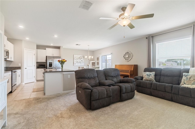 6180 Spring Crayfish Ave, New Port Richey, FL 34653 - living area with light colored carpet, healthy amount of natural light, a chandelier, ceiling fan, and recessed lighting