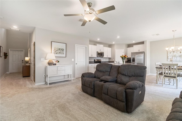 6180 Spring Crayfish Ave, New Port Richey, FL 34653 - living area with light carpet, ceiling fan, a chandelier, recessed lighting, and baseboards