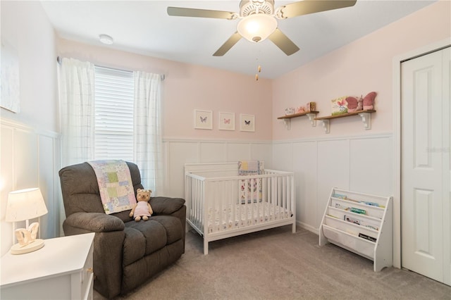 6180 Spring Crayfish Ave, New Port Richey, FL 34653 - bedroom with wainscoting, light carpet, a decorative wall, and ceiling fan