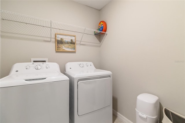 6180 Spring Crayfish Ave, New Port Richey, FL 34653 - washroom featuring separate washer and dryer and baseboards