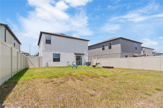 6180 Spring Crayfish Ave, New Port Richey, FL 34653 - back of property featuring stucco siding and central air condition unit