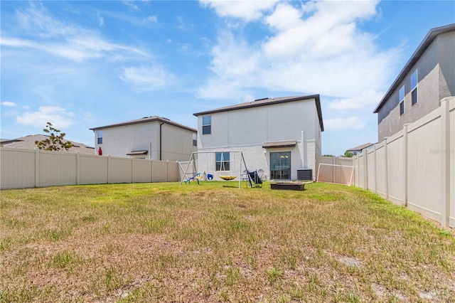 6180 Spring Crayfish Ave, New Port Richey, FL 34653 - back of house with cooling unit and stucco siding