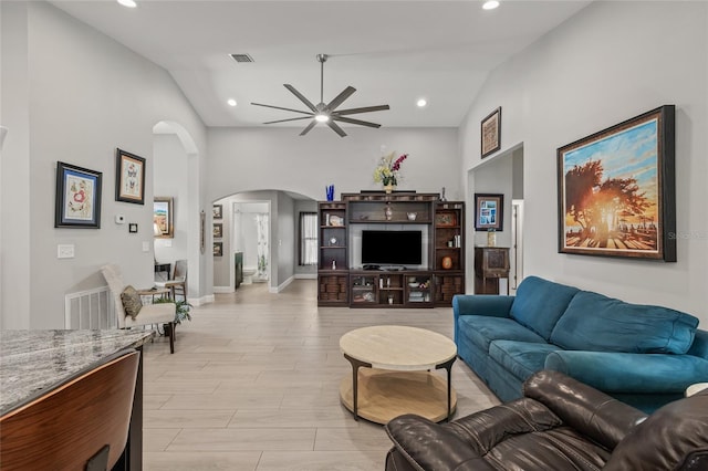 6741 51st Way N, Pinellas Park, FL 33781 - living area with arched walkways, ceiling fan, lofted ceiling, recessed lighting, and baseboards