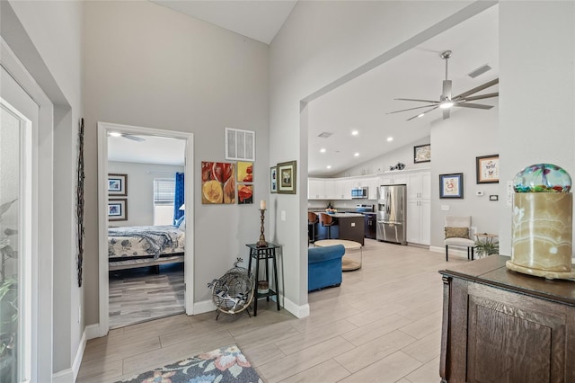 6741 51st Way N, Pinellas Park, FL 33781 - corridor featuring high vaulted ceiling, light wood-style flooring, baseboards, and recessed lighting
