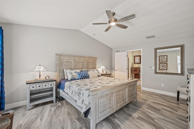 6741 51st Way N, Pinellas Park, FL 33781 - bedroom featuring baseboards, vaulted ceiling, light wood-type flooring, and ceiling fan