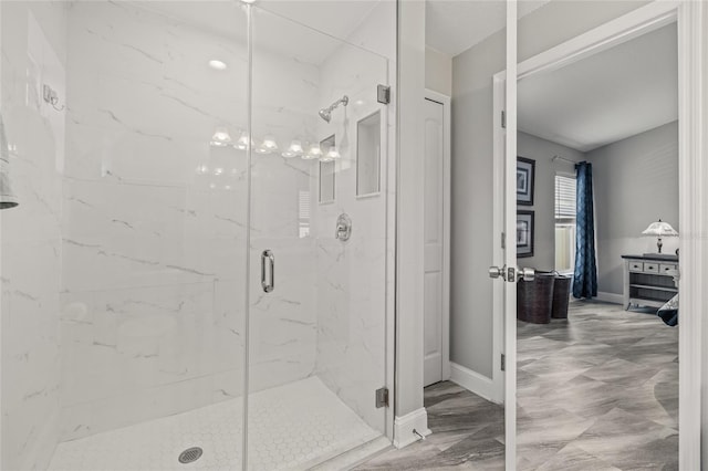 6741 51st Way N, Pinellas Park, FL 33781 - bathroom featuring a marble finish shower and baseboards