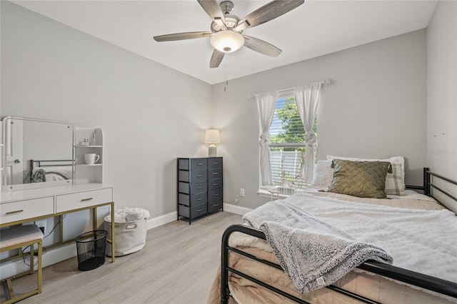 6741 51st Way N, Pinellas Park, FL 33781 - bedroom with wood finished floors, baseboards, and ceiling fan