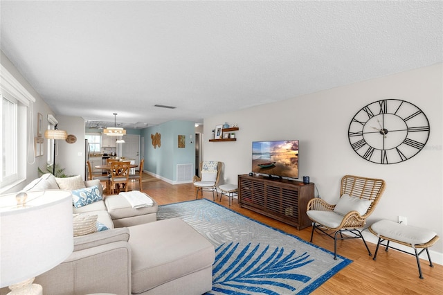 6075 Shore Blvd S Unit 215, Gulfport, FL 33707 - living room featuring wood finished floors and baseboards