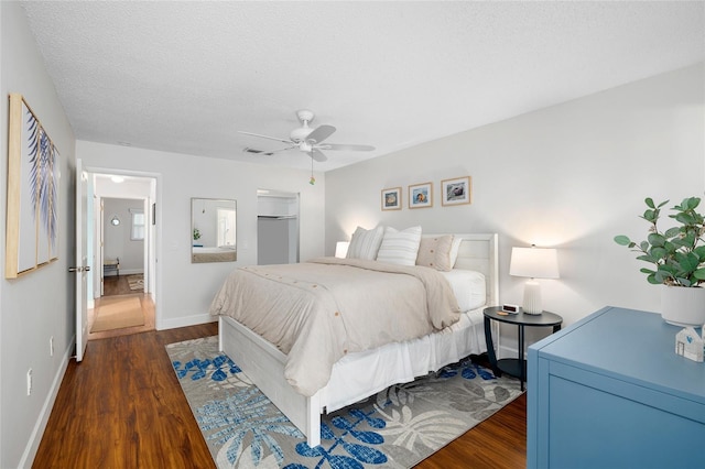 6075 Shore Blvd S Unit 215, Gulfport, FL 33707 - bedroom with dark wood-style floors, baseboards, and a ceiling fan