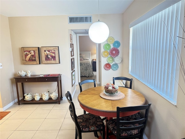 102 Cambridge Trl Unit 230, Sun City Center, FL 33573 - dining room with light tile patterned flooring and baseboards