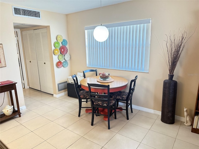 102 Cambridge Trl Unit 230, Sun City Center, FL 33573 - dining area featuring baseboards and tile patterned flooring