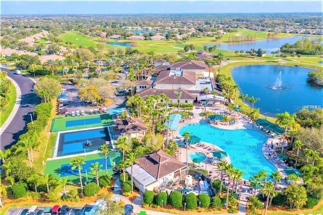 102 Cambridge Trl Unit 230, Sun City Center, FL 33573 - drone / aerial view of a nearby body of water, a golf club, and a pool area