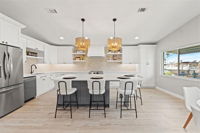 4012 Marine Pkwy, New Port Richey, FL 34652 - kitchen featuring open shelves, stainless steel appliances, a chandelier, custom range hood, and light countertops