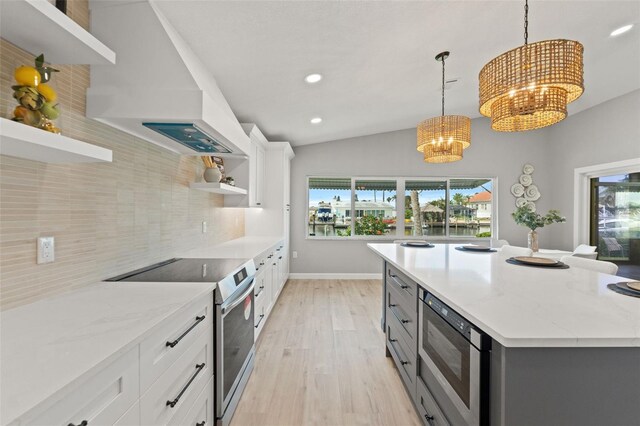 4012 Marine Pkwy, New Port Richey, FL 34652 - kitchen featuring open shelves, stainless steel appliances, a chandelier, backsplash, and plenty of natural light