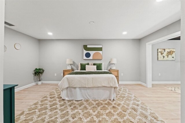 4012 Marine Pkwy, New Port Richey, FL 34652 - bedroom featuring wood finished floors, recessed lighting, and baseboards